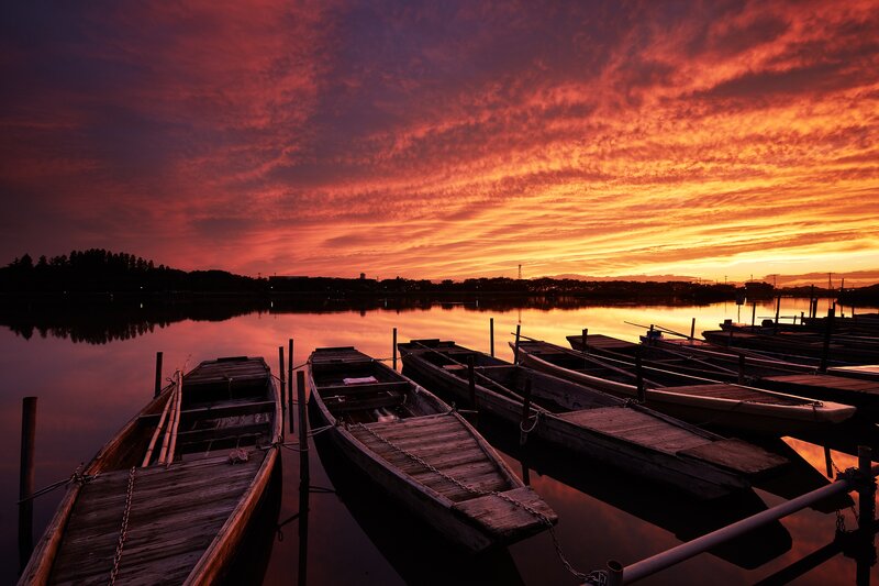 Wooden Boats at Sunset — Red