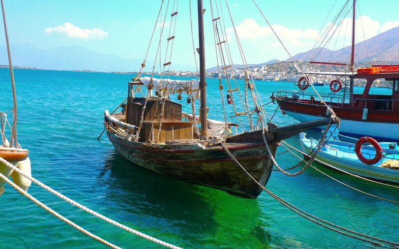 Wooden boats in a sunny harbor