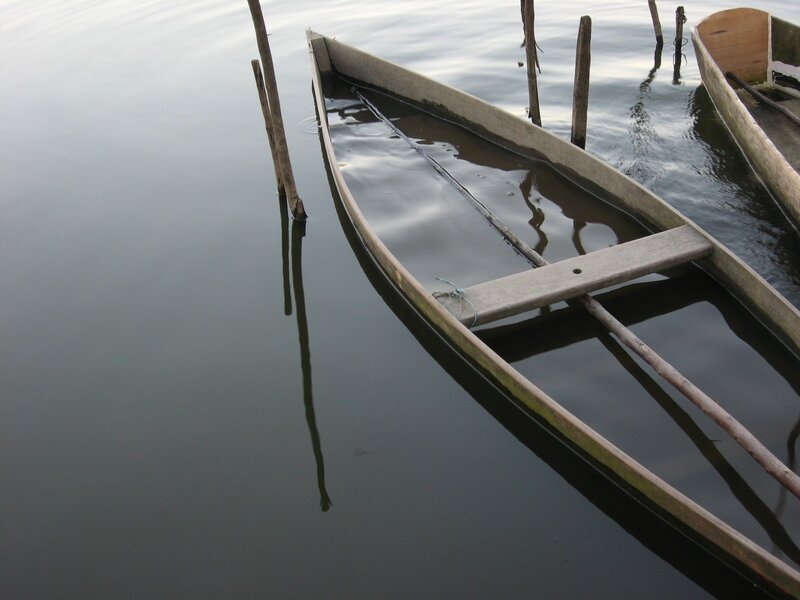 wooden boats on calm water
