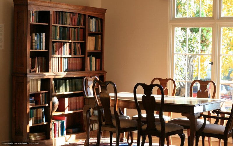 wooden bookshelf and dining table