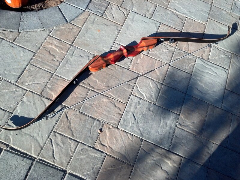 Wooden Bow on Pavement