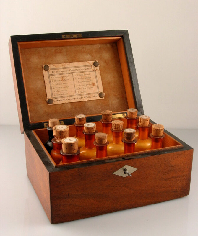Wooden box with medicine bottles