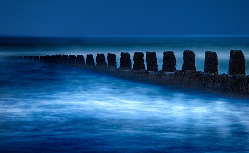 Wooden Breakwater at Night