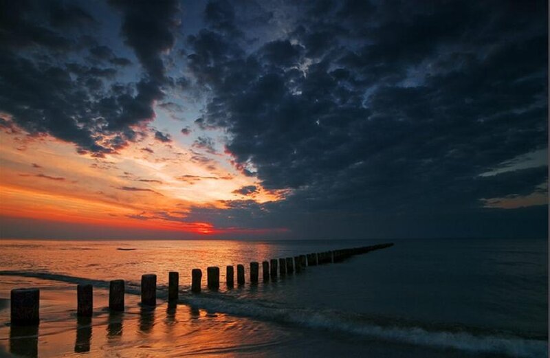 Wooden Breakwater at Sunset — Orange