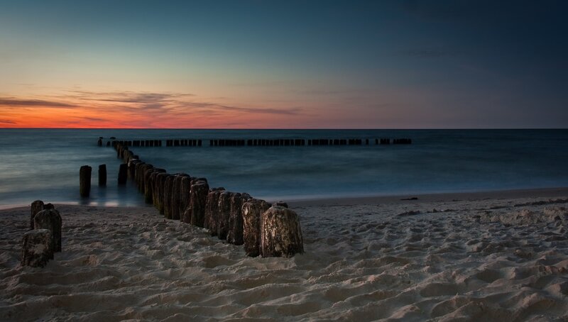 Wooden Breakwater at Sunset