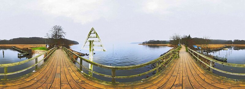 Wooden bridge over a calm lake