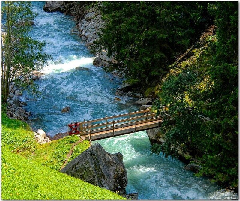 Wooden bridge over a rushing river