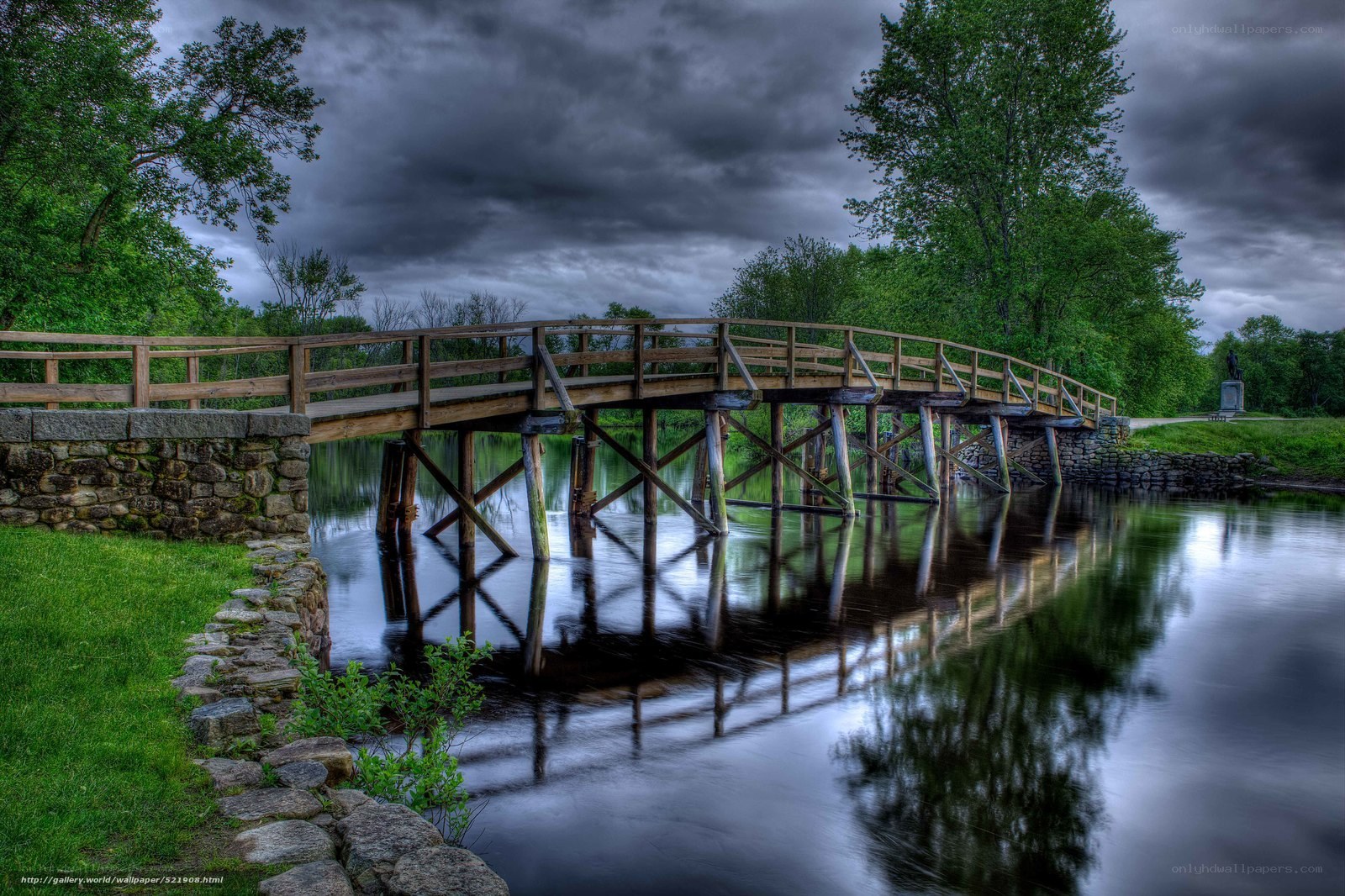 Wooden bridge over calm river
