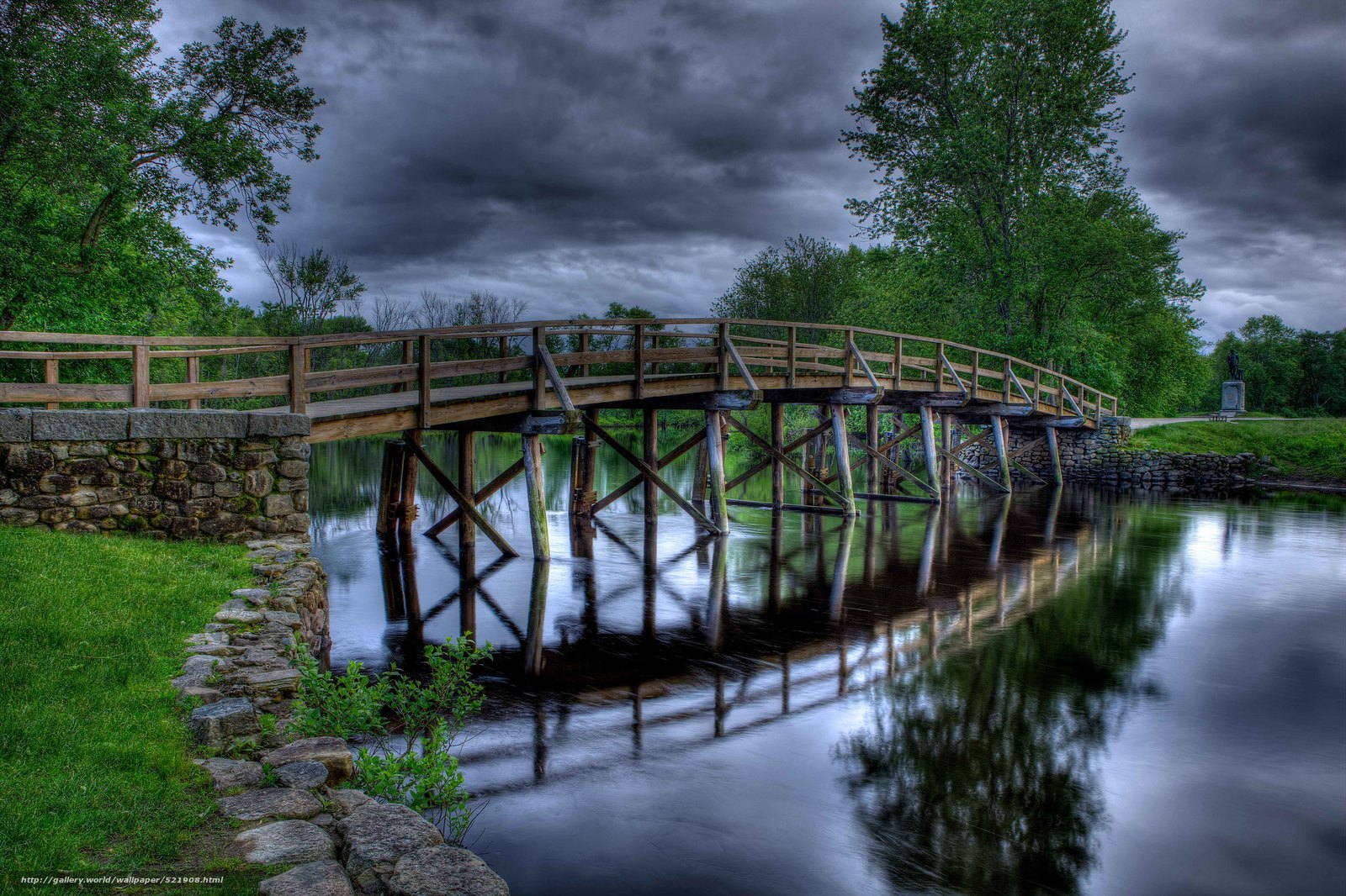 Wooden bridge over calm river