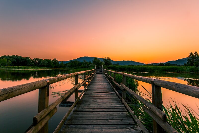 Wooden Bridge over Lake — Orange, Serene, Sunset