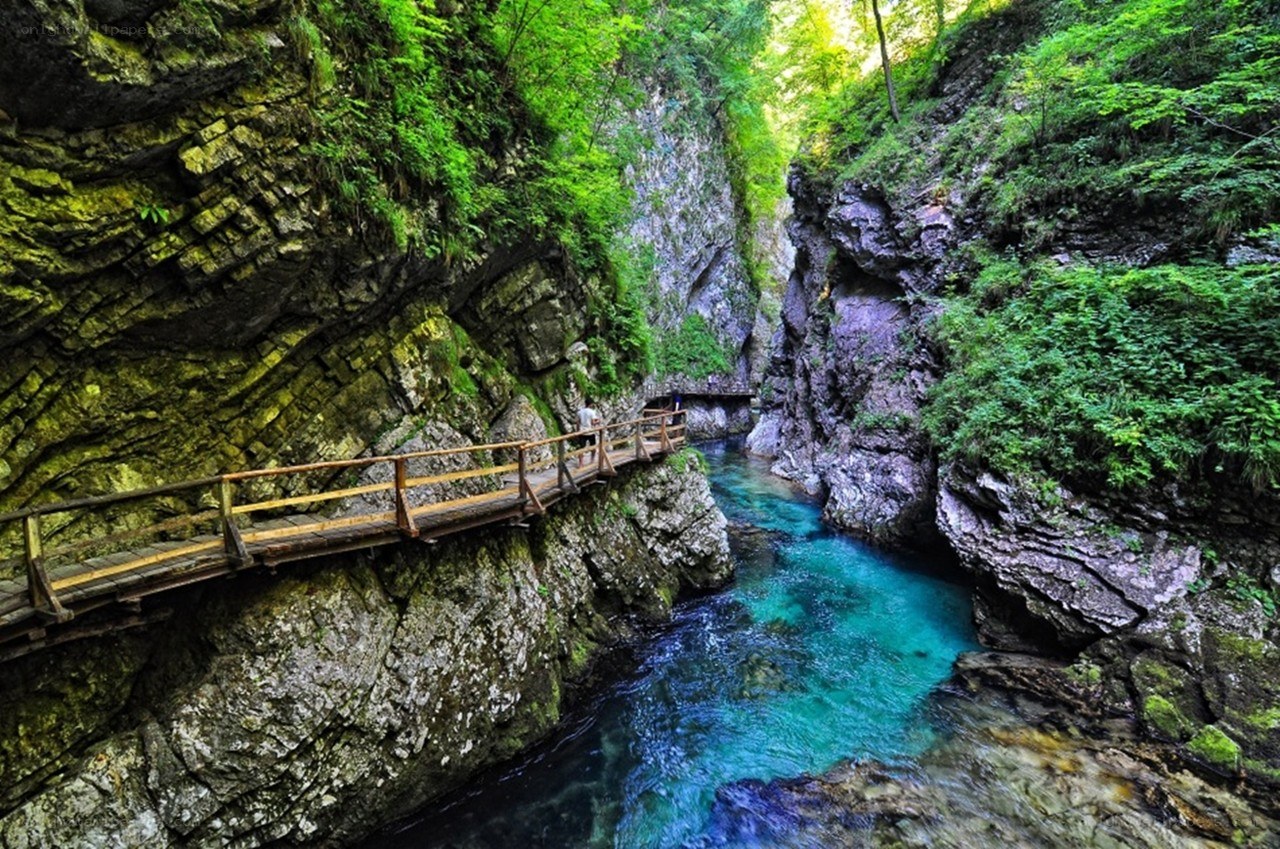 Wooden bridge over turquoise river