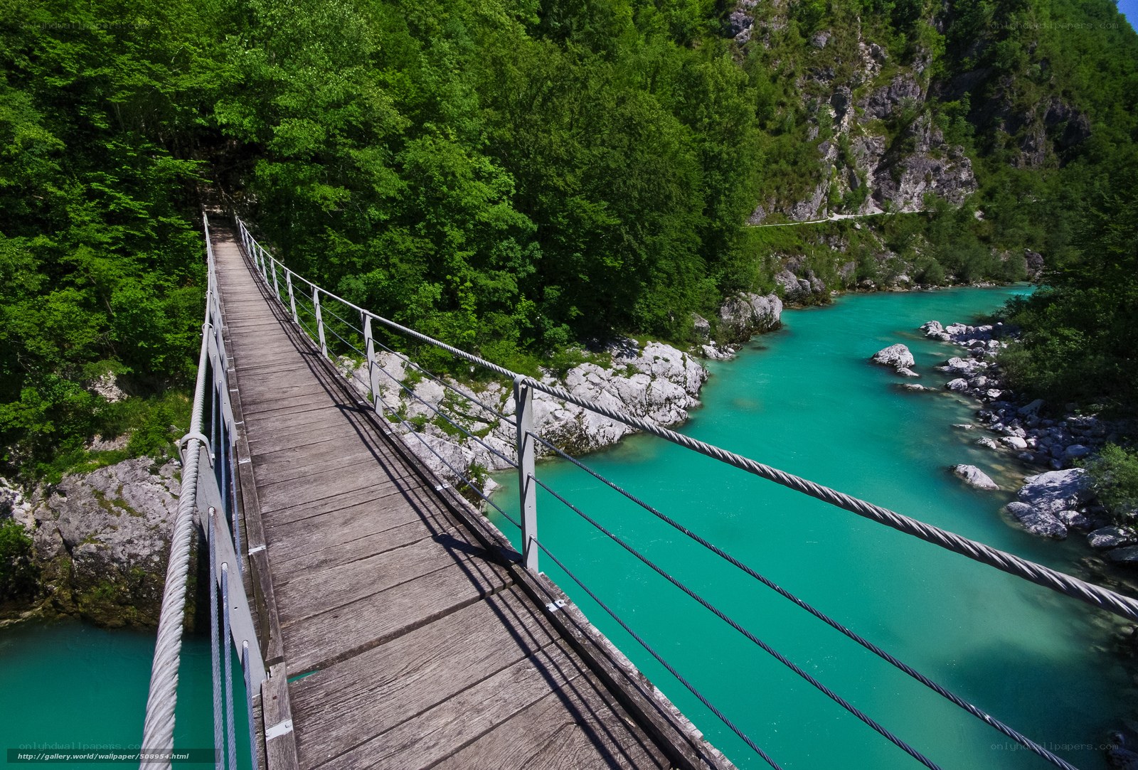 Wooden bridge over turquoise river