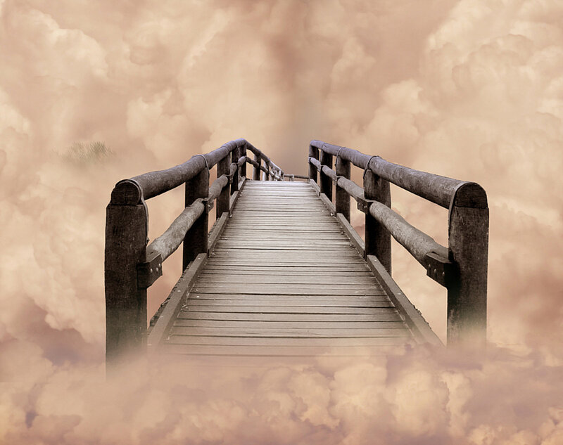 Wooden bridge through clouds