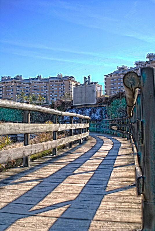 Wooden bridge with city view