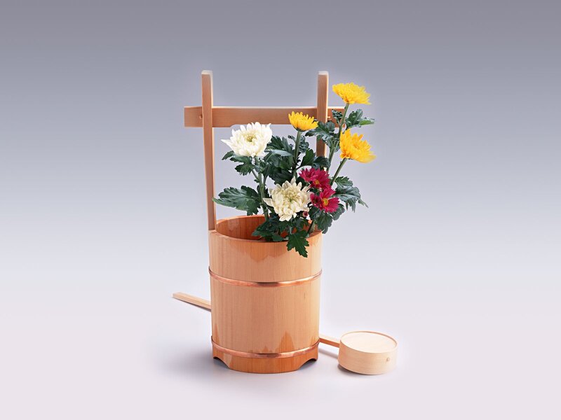 Wooden bucket with flowers