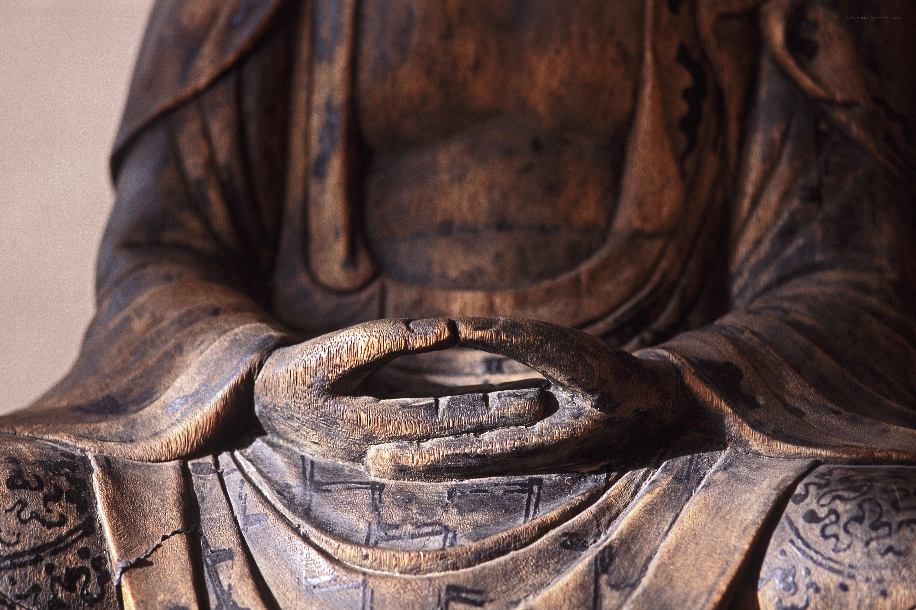 wooden buddha statue hands