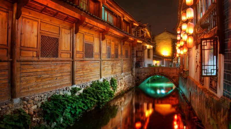 Wooden Buildings Along Canal — Brown