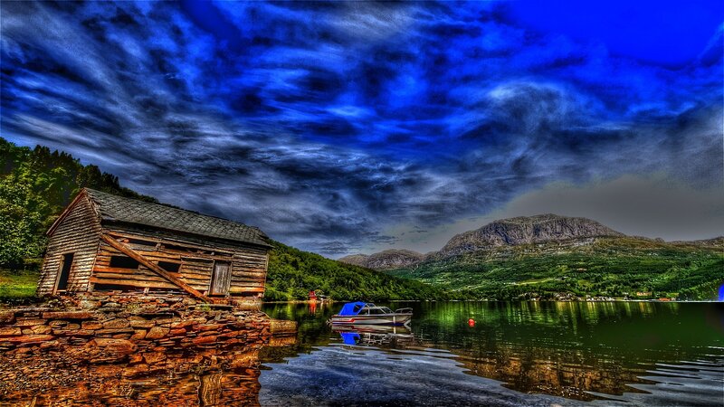 Wooden cabin by a fjord