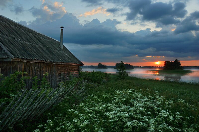 Wooden Cabin by Lake — Blue, Serene, Sunset, Photograph, Clouds