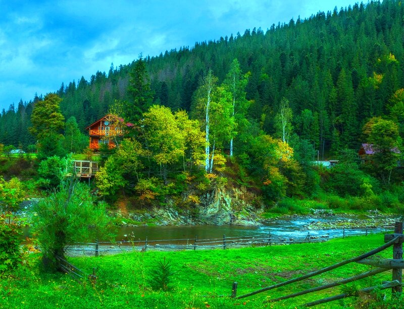 Wooden Cabin by River — Green, Serene, Afternoon, Photograph