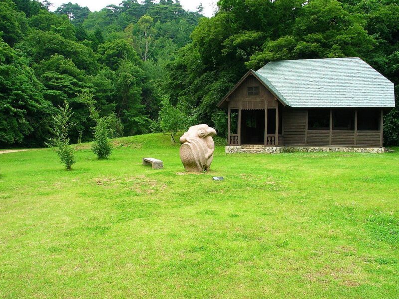Wooden cabin in a green park