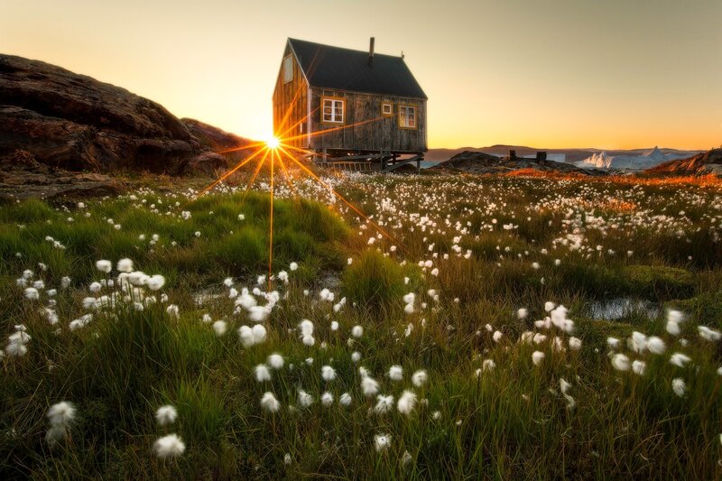 Wooden Cabin in Field — Green, Serene, Sunset