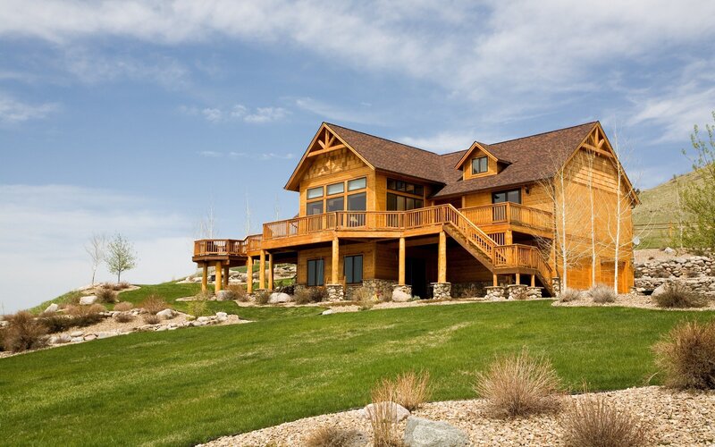 Wooden cabin on a grassy hill