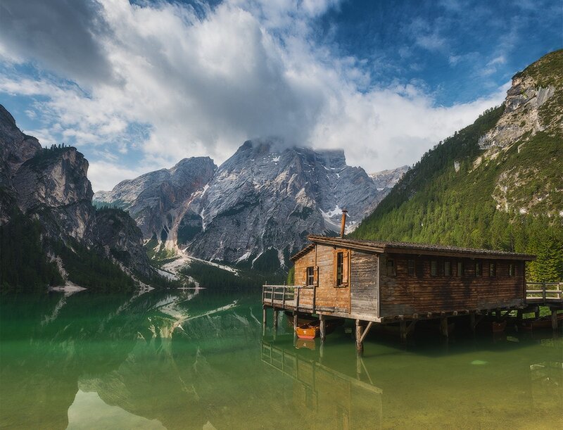 Wooden cabin on a mountain lake