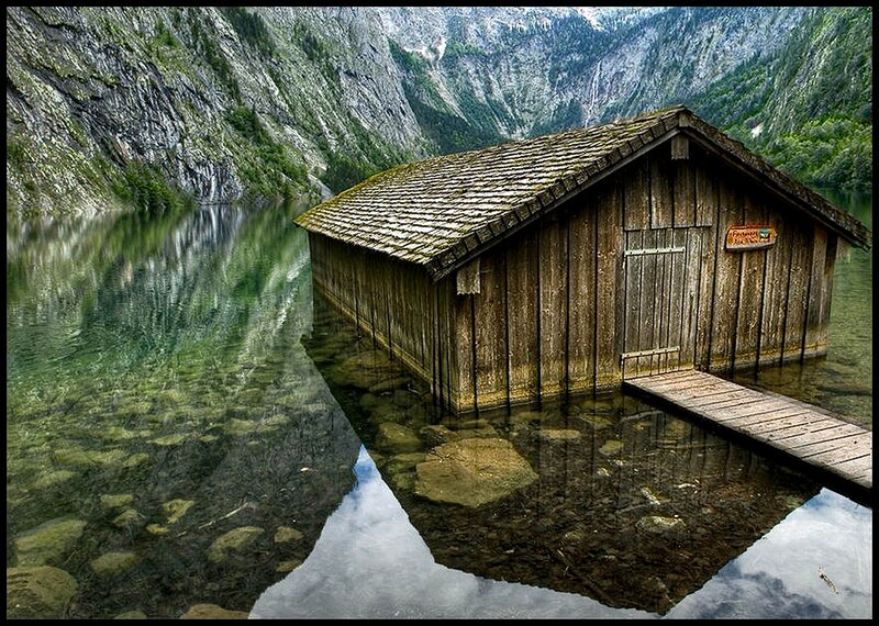 Wooden cabin on a mountain lake