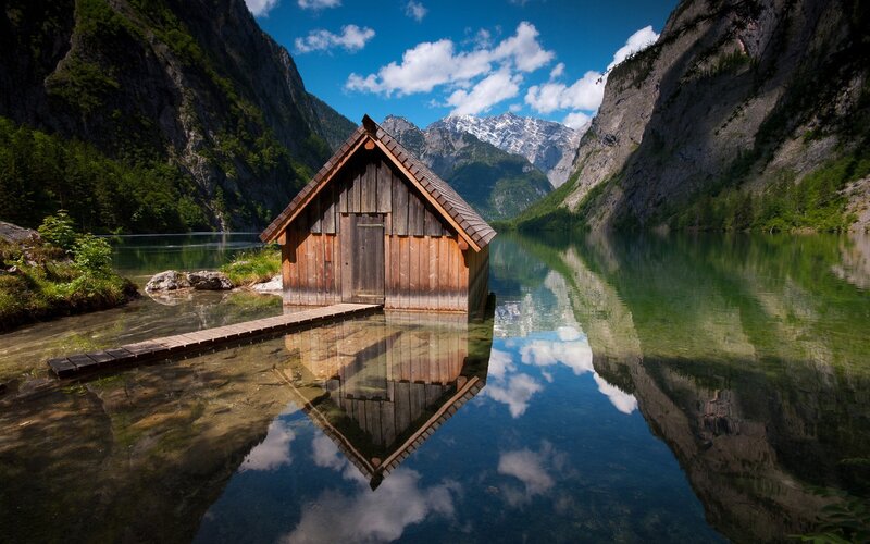 Wooden cabin on a mountain lake