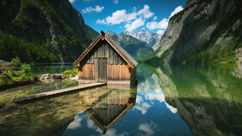 Wooden cabin on a mountain lake