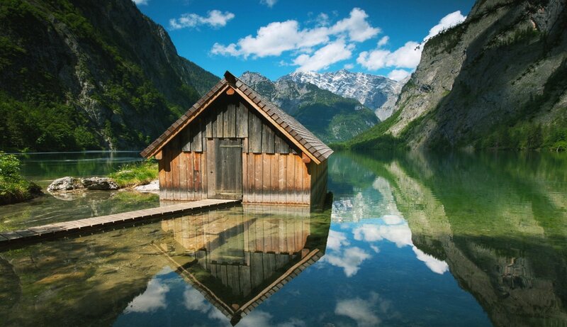 Wooden cabin on a mountain lake