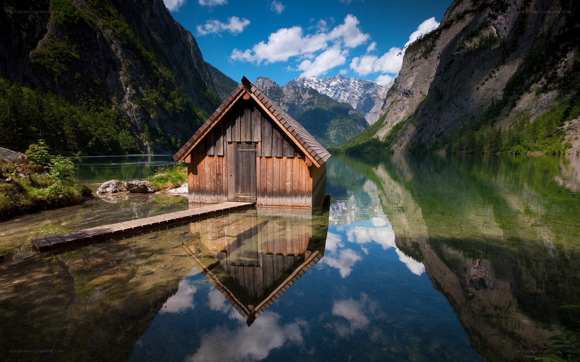 Wooden cabin on a mountain lake