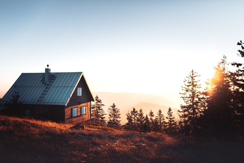 Wooden Cabin on Hillside — Blue, Serene, Sunset