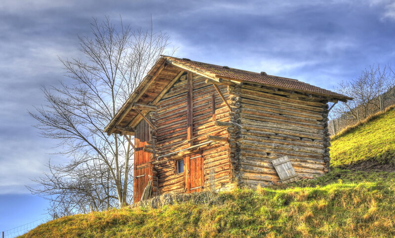 Wooden Cabin on Hillside — Brown, Dramatic