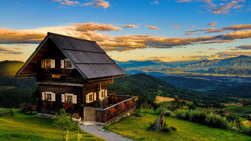 Wooden Cabin on Hillside — Green, Serene, Sunset, Photograph