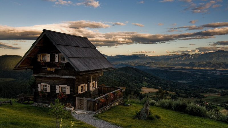 Wooden Cabin on Hillside — Green, Serene, Sunset