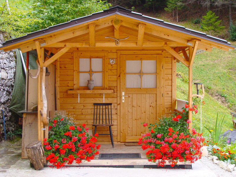 Wooden Cabin with Flowers