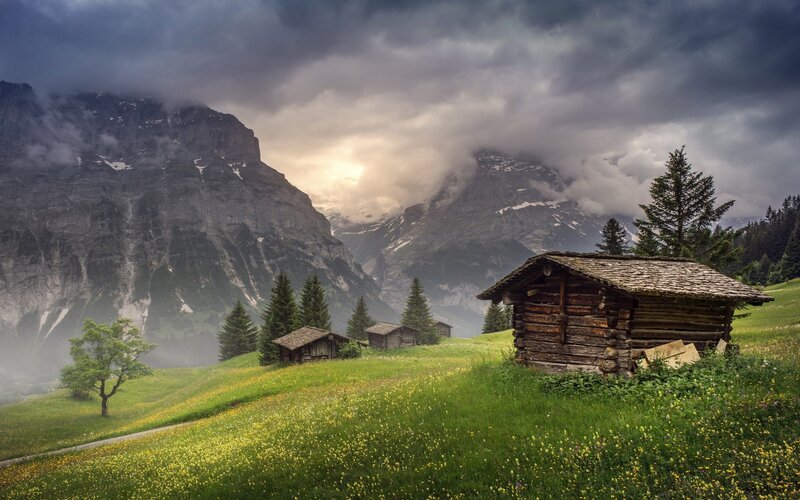 Wooden Cabins in Mountains — Green, Dramatic