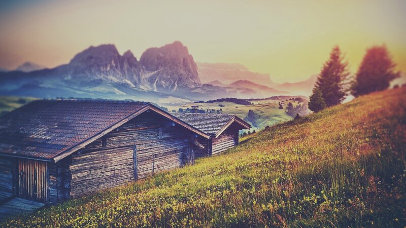 Wooden Cabins in Mountains — Green, Serene, Sunset, Photograph, Grass