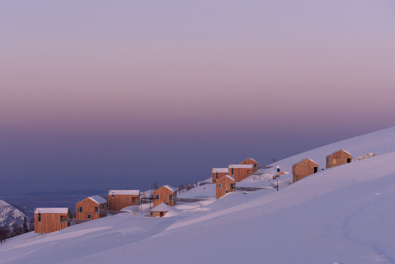 Wooden Cabins in Snow — White, Serene, Sunset