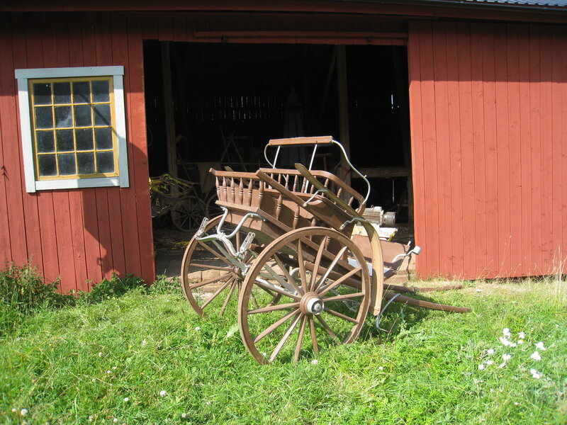 Wooden Carriage Outside Barn