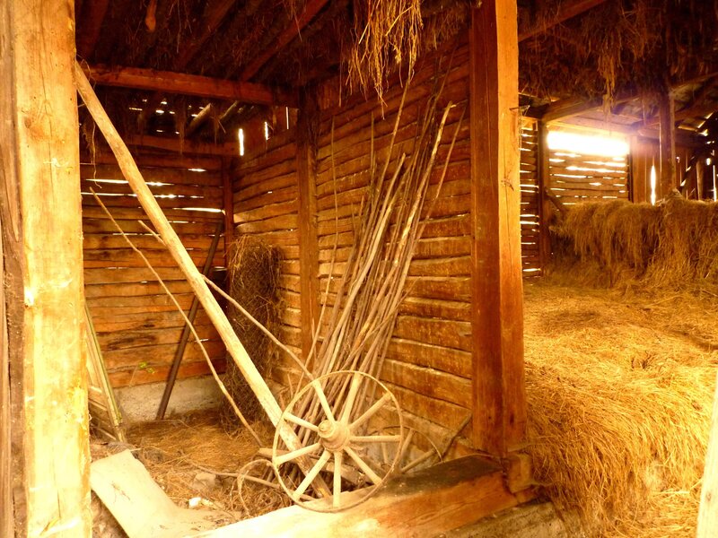 Wooden Cart Wheel in Barn