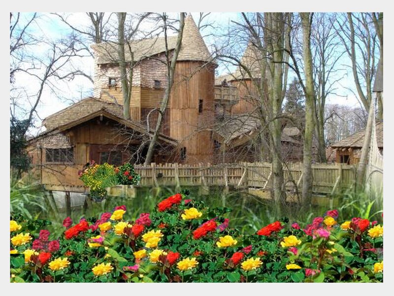 Wooden castle in a flower garden