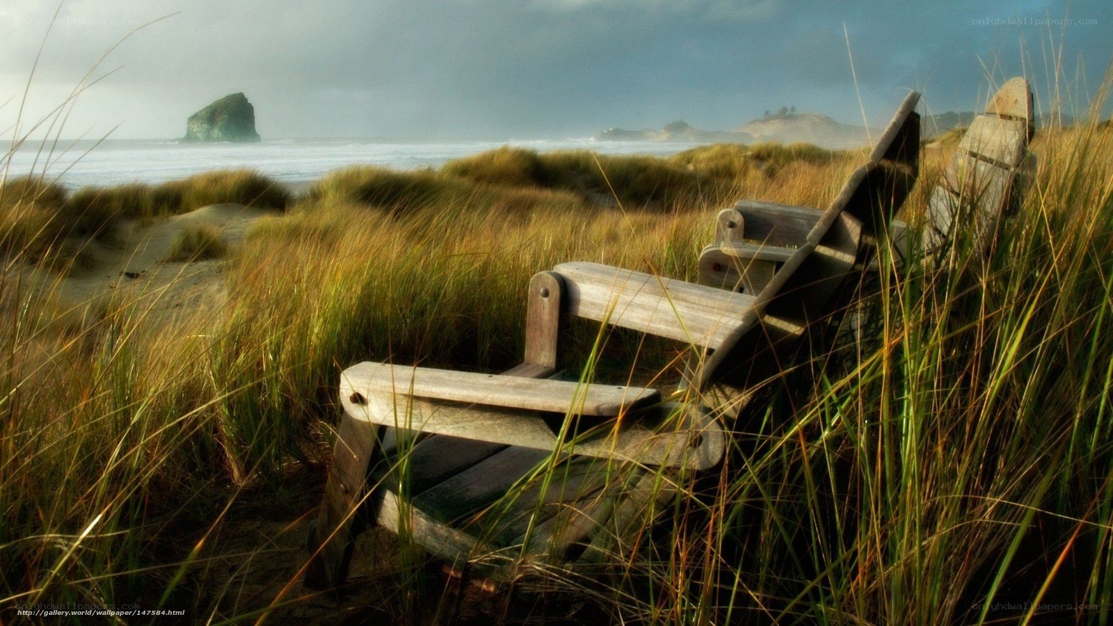 Wooden chairs on a beach