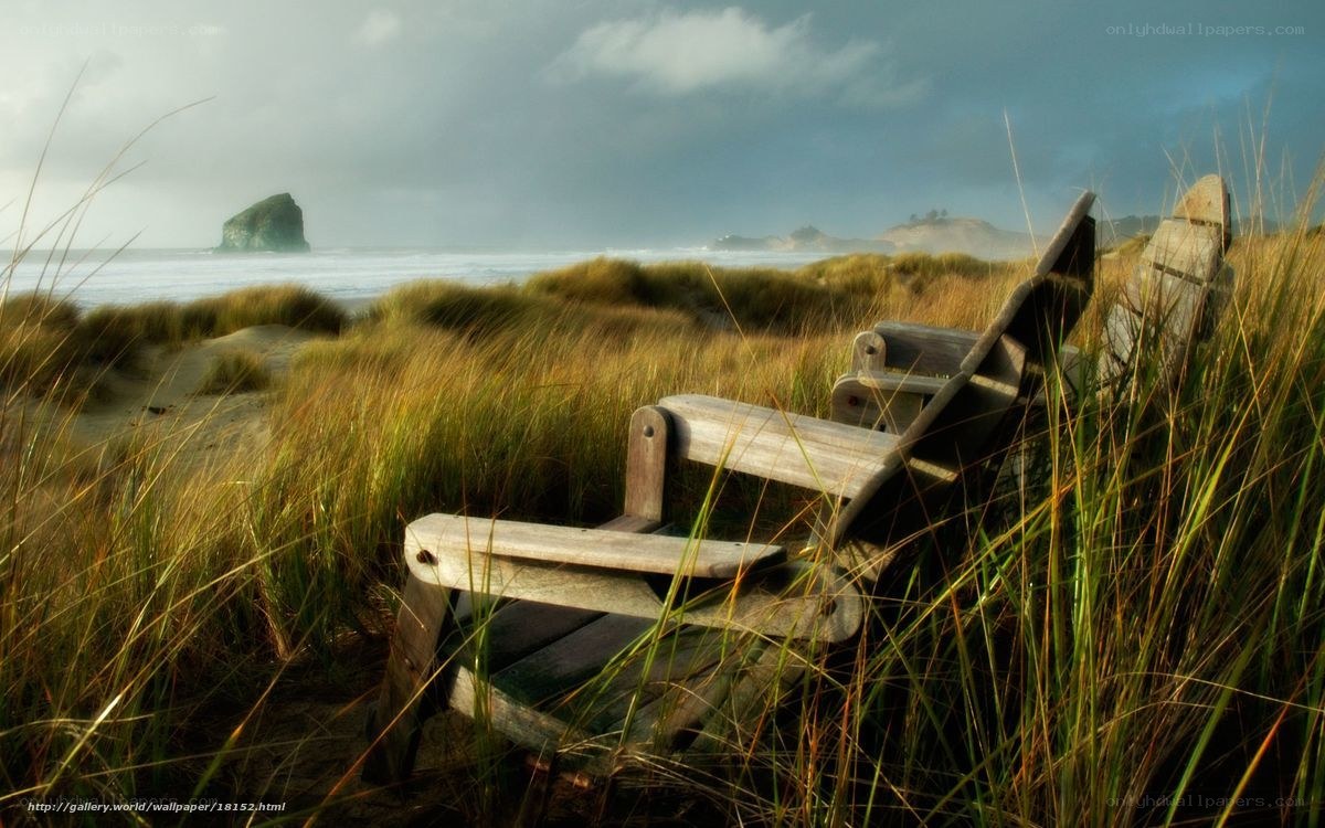 Wooden chairs on a beach