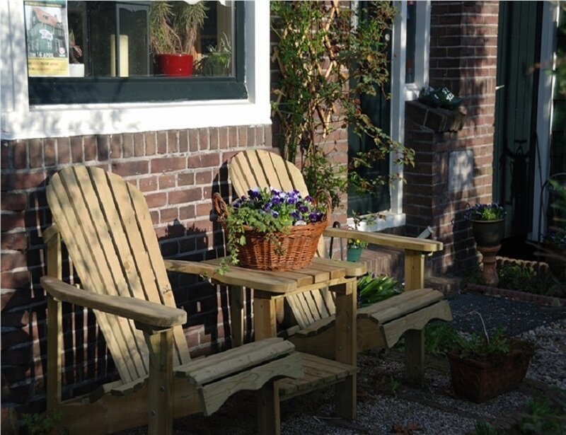 Wooden chairs on a brick patio