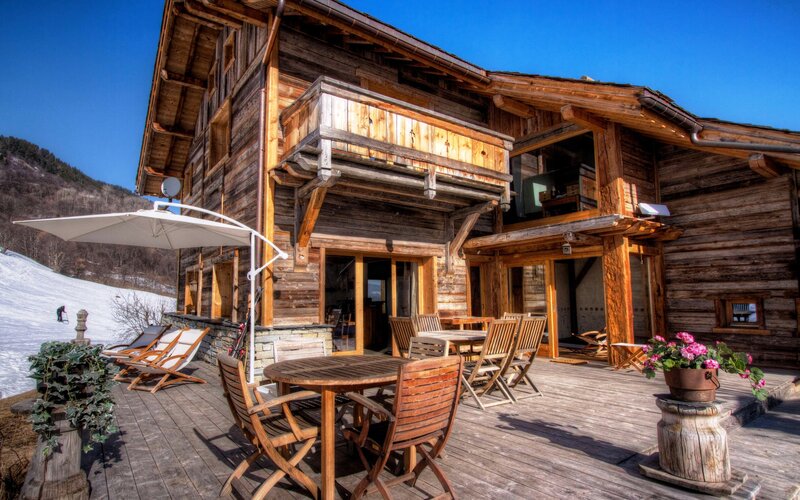 Wooden Chalet in Snow