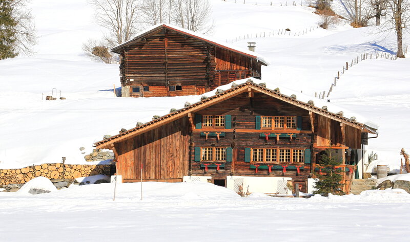 Wooden Chalets in Snow