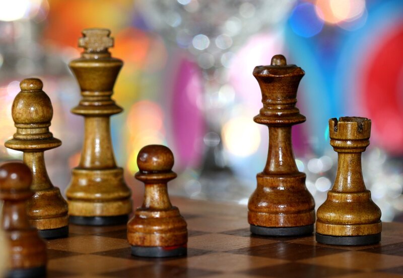 Wooden chess pieces on board
